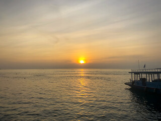 Beautiful ocean sunset and boat