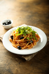 Pasta with olives and arugula