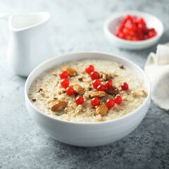 Healthy oatmeal porridge with berries and almond