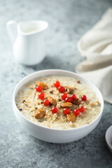 Fototapeta na wymiar Healthy oatmeal porridge with berries and almond