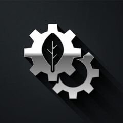 Silver Leaf plant ecology in gear machine icon isolated on black background. Eco friendly technology. World Environment day label. Long shadow style. Vector.