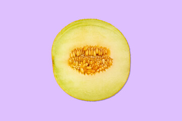 delicious galia melon (cucumis melo) - background purple