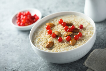 Healthy oatmeal porridge with berries and almond