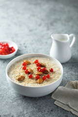 Healthy oatmeal porridge with berries and almond