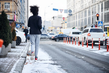 Obraz premium Athlete is running away from the camera