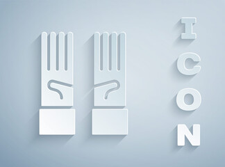 Paper cut Medical rubber gloves icon isolated on grey background. Protective rubber gloves. Paper art style. Vector.