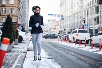 Woman going for a run on a roadside