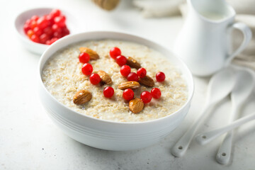 Healthy oatmeal porridge with berries and almond