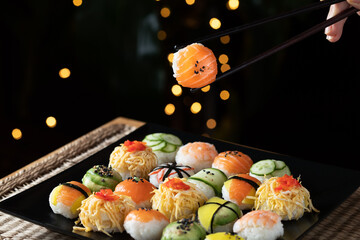 Sushi ball in warm color and dark background