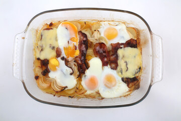 fried eggs with bacon potatoes onions and cheese