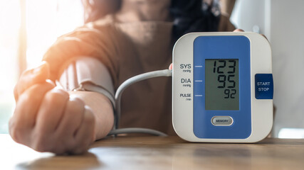 Blood pressure monitoring with digital sphygmomanometer for patient with hypertension or high blood...