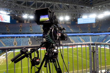 TV at the soccer. video camera back football goal.