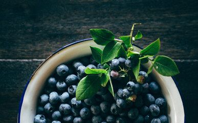 close up of blueberries in white bowl