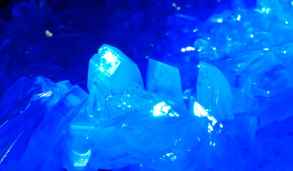 Macrophotography of blue transparent crystals of copper sulfate. Crystal surface texture.
