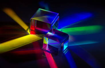 a glass cube reflects many colors