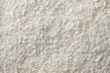 White dried shredded coconut meat full frame close up