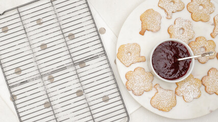 Flower shaped shortbread cookies filled with raspberry jam recipe.