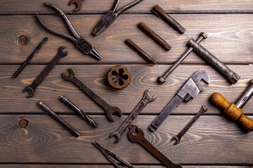 top view of vintage technical instruments on wooden background