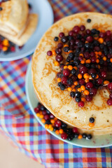 Pancakes with frozen berries and honey