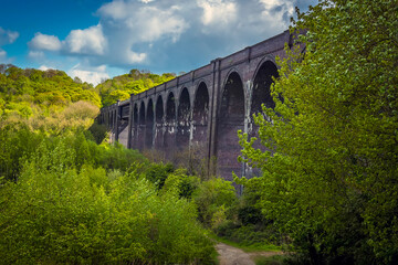 Fototapeta na wymiar A view along the side of the Conisbrough Viaduct in Conisbrough, Yorkshire, UK in springtime