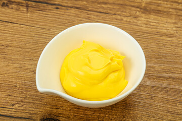 Natural cheese sauce in the bowl