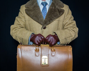 Portrait of Businessman in Suit and Brown Fur Coat Holding Attache Case or Briefcase. Concept of...