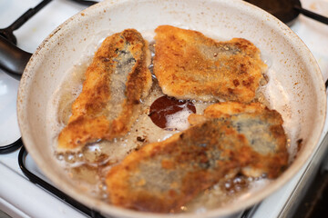 Carp fish fry on pan with oil