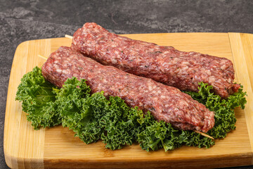 Raw minced beef kebab skewer
