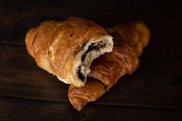 Two french croissants with chocolate
