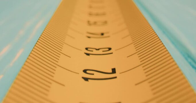 Roll of measuring tape in motion macro