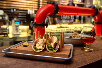 Traditional street mexican pork tacos with beef, tomatoes, avocado, chilli in yellow corn tortilla