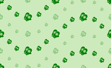 Seamless pattern of large and small green mittens symbols. The elements are arranged in a wavy. Vector illustration on light green background