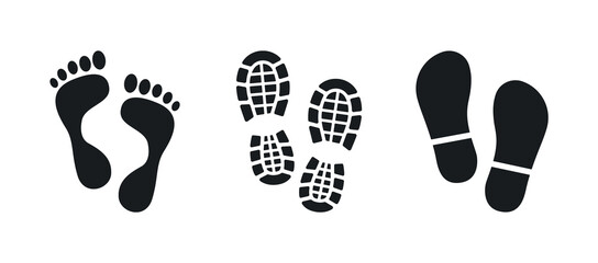 Human footprints. Bare foot prints. Shoe soles print. Black traces of human. Step footprints. Shoe tread prints.
