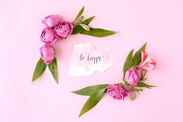 Card "Be happy" on pink background with rose buds.