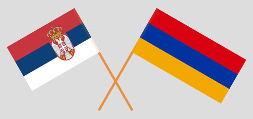 Crossed flags of Serbia and Armenia. Official colors. Correct proportion. Vector illustration