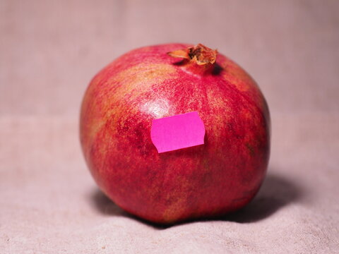 Pomegranate With Price Sticker. Market And Store Prices.