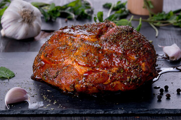 roast with herbs on a black stone © Patrycja
