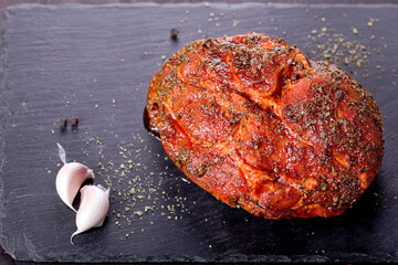 roast with herbs on a black stone © Patrycja