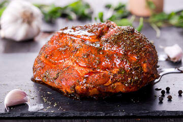 roast with herbs on a black stone © Patrycja