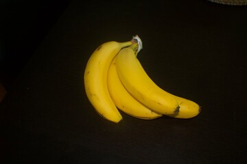 Bananas against black background