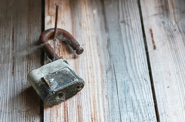 Padlock on old wooden barn door. Place for text