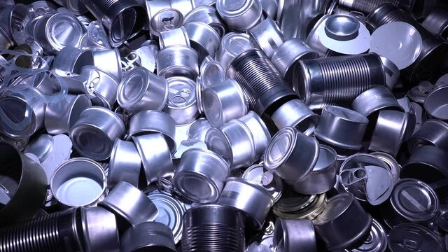 Large amount of metal tins, cans and jars for recycling. Aluminum metal food and drink sorted scraps. Steel packaging. Zero waste and recycle of domestic waste at home concept. No pollution.