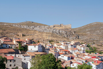Fototapeta na wymiar General view of the village of Talamantes with the 12th century castle in the background located in Aragon, Spain