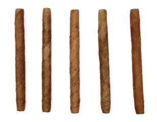 Set luxury handmade cigars isolated on white background, top view