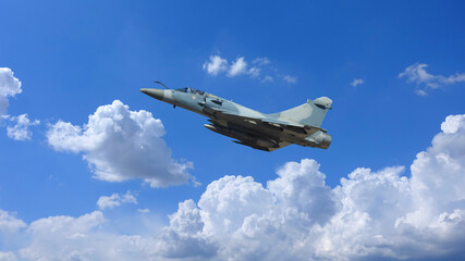 Naklejka na ściany i meble Ultra zoom photo of fighter interceptor plane performing extreme stunts in deep blue cloudy sky