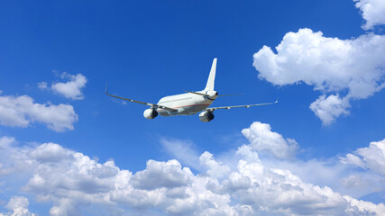 Fototapeta na wymiar Zoom photo of passenger airplane flying in deep blue sky and beautiful clouds