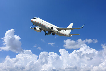 Fototapeta na wymiar Zoom photo of passenger airplane taking off in deep blue sky and beautiful clouds