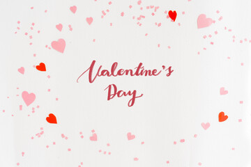close up on white color background with pastel colorful heart shape and confetti with valentine's day calligraphy message concept