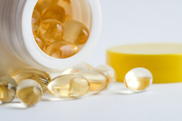 Vitamin E Capsules Spilled from a Bottle