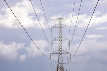 Electricity pole with silhouette sunset sky, Electricity pylon with shadow of tree in dawn time, Electricity power transmission line on sunset with copy space, Electricity pylon on orange sky